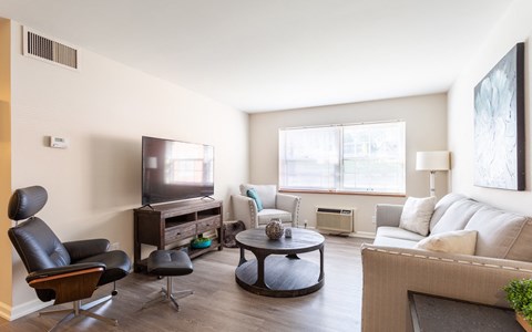 a living room with a couch and a table and a television